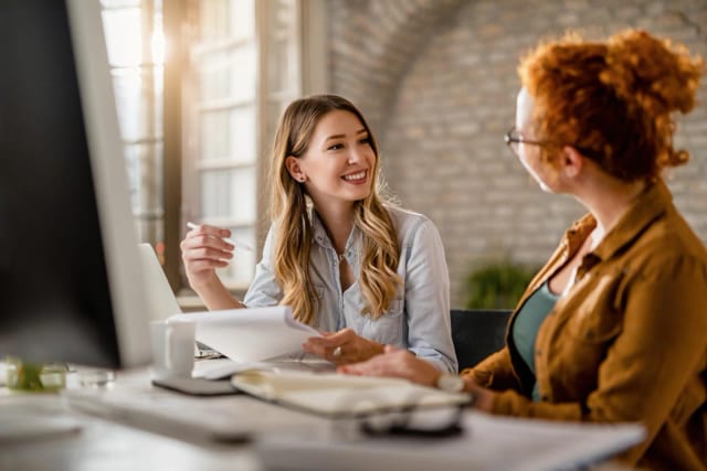 Two professionals work through focused communication practice
